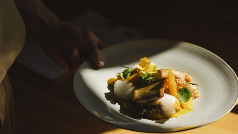 Roasted salmon trout fillet, pumpkin emmer risotto and Hokkaido pumpkin from the oven, © Niederösterreich Werbung/Michael Reidinger