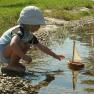 Child with wooden ship, &copy; Familie Erber